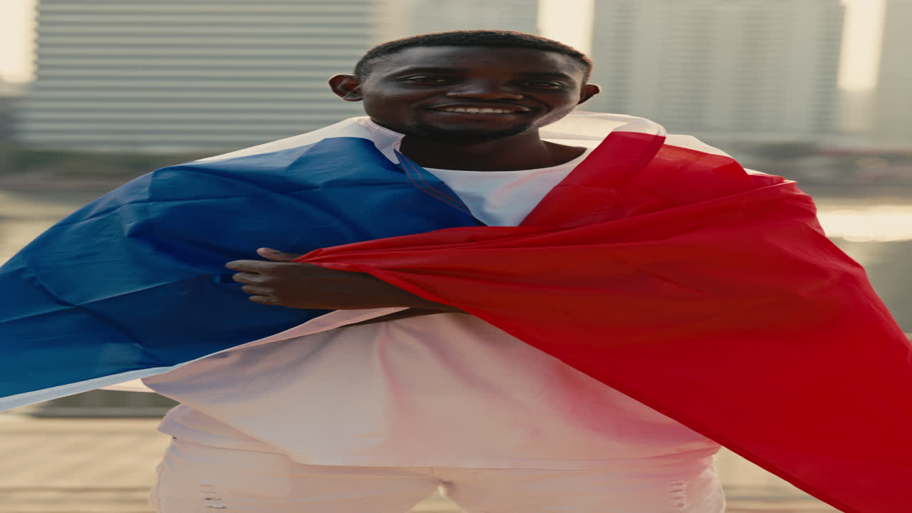 Man draped with the French flag