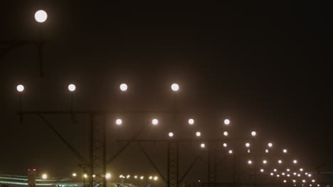 airplane landing at night in foggy conditions