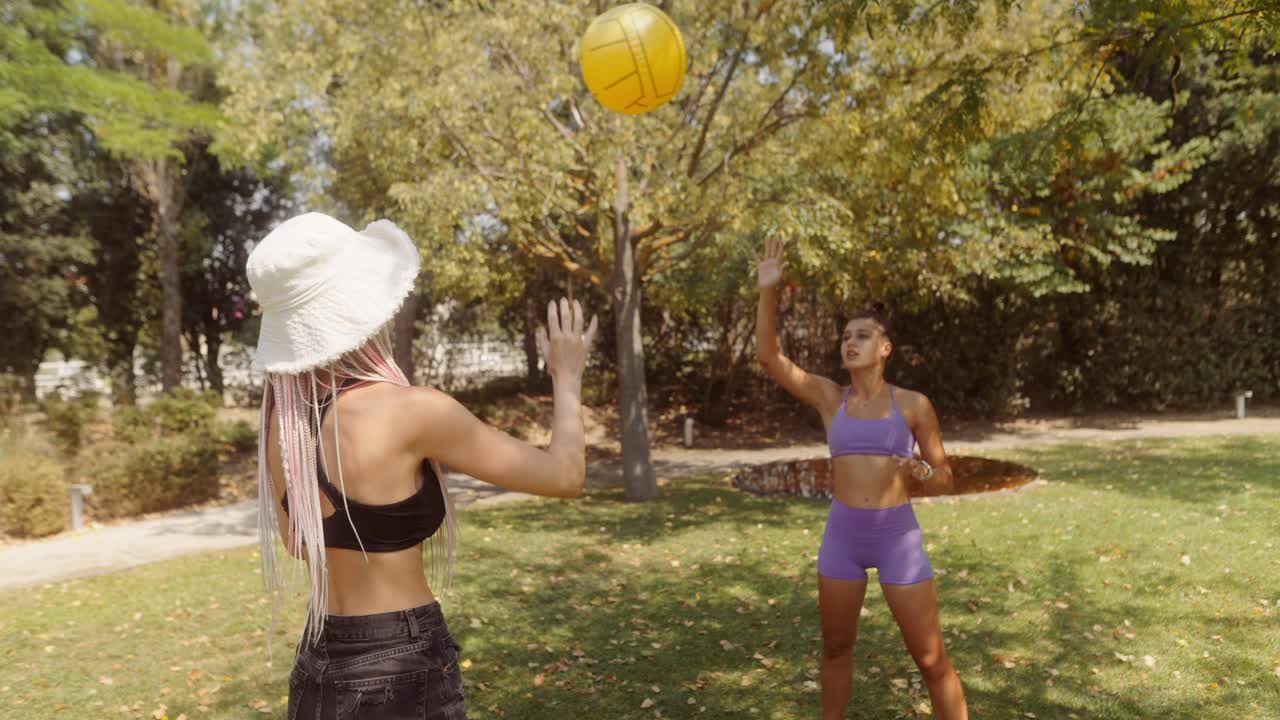 Women playing volleyball in the park