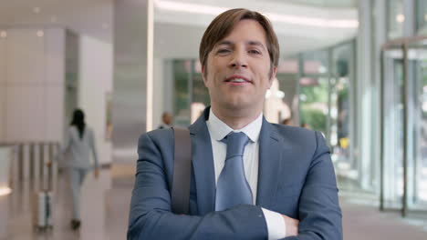 Portrait-of-Mature-Businessman-at-work-in-busy-office-lobby