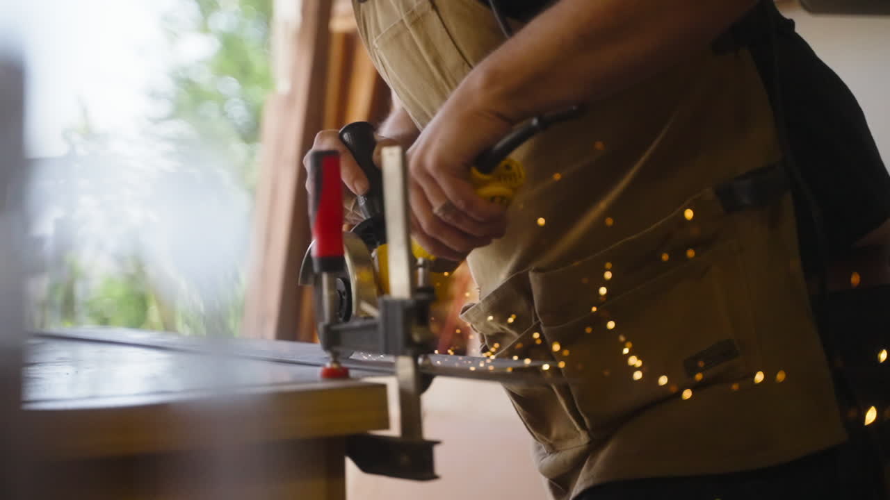 Carpenter Cuts Metal Shooting Sparks in Slow Motion Revealed Behind Glass