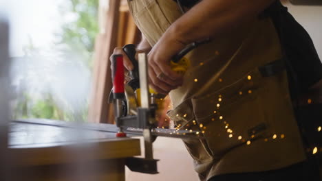 Carpenter-Cuts-Metal-Shooting-Sparks-in-Slow-Motion-Revealed-Behind-Glass