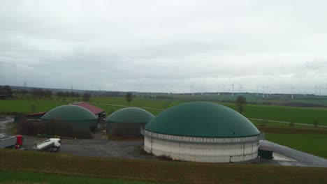 green energy in action: an aerial view of a biogas plant and farm in germany