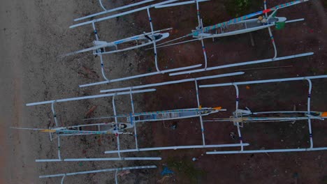 Local-fishing-boats-at-Amed-Bali-Indonesia-during-sunrise,-aerial