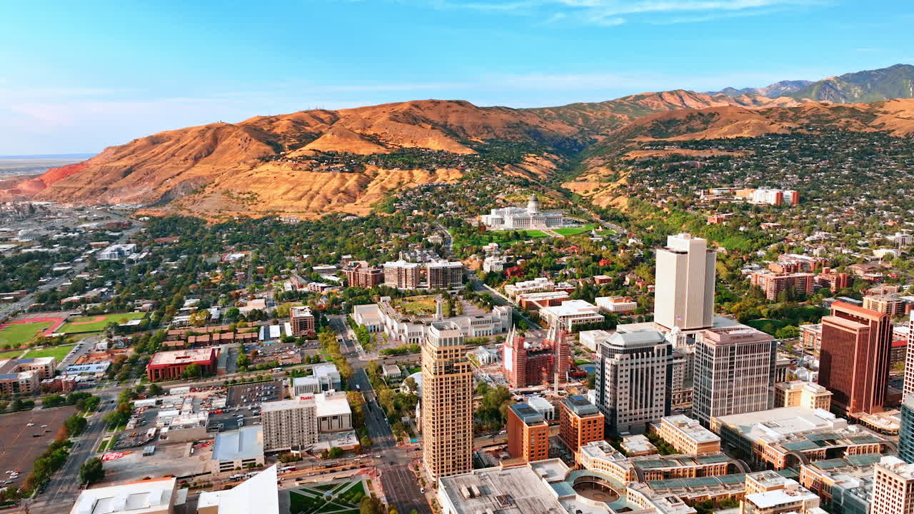 Salt Lake City, USA, 14 August 2025: Vast city panorama of modern Salt Lake City, Utah, USA. Downtown and uptown of the city surrounded by the rocks. Aerial view