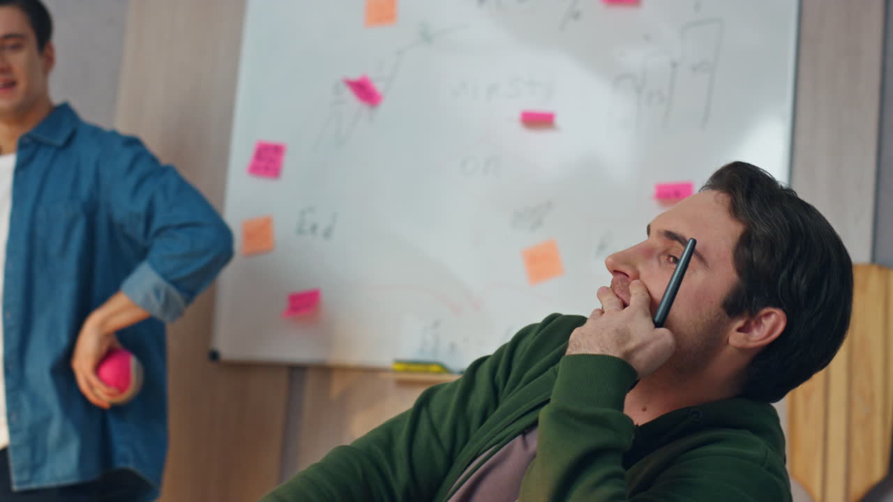 Happy team talking computer workplace closeup. Two freelancers working together