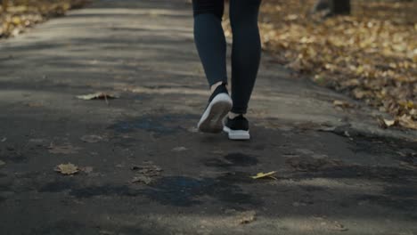 Low-section-of-woman's-legs-start-jogging-at-the-park