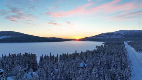 frozen lake of pyhajarvi during sunset in lapland, finland