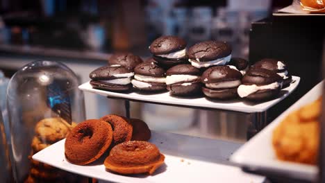 display of grain free cakes on coffee shop counter