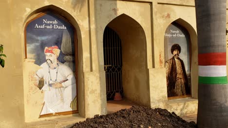 close up video shot of portraits of nawabs on the historic building with indian flag colors - historic figures framed: nawabs in arched windows