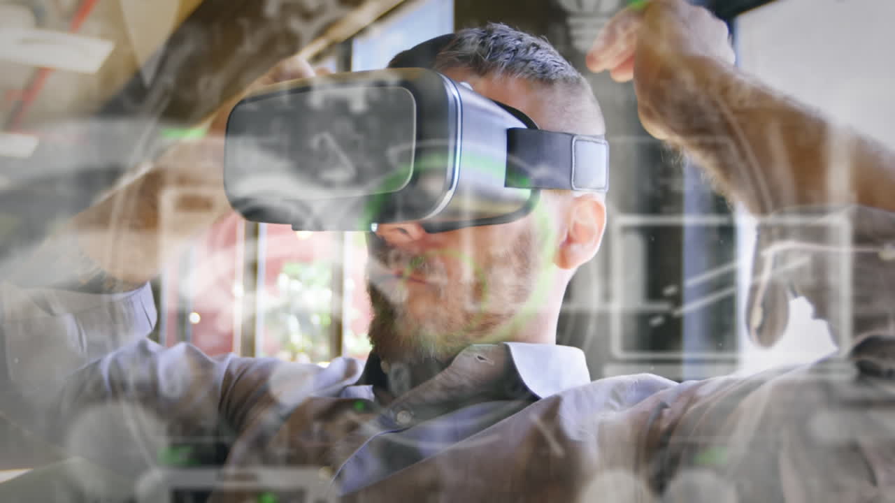 múltiples iconos digitales y procesamiento de datos contra un hombre caucásico que lleva un auricular vr en la oficina