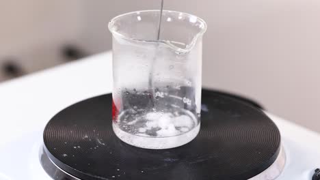 sodium acetate crystallizing in a beaker over time