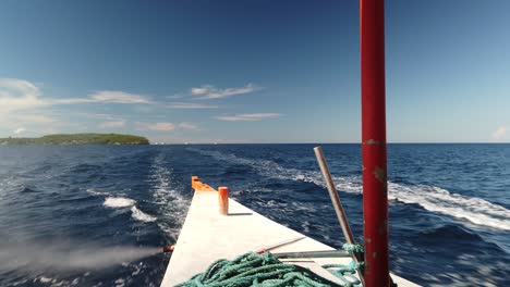 rear passenger view on travel boat leaving island