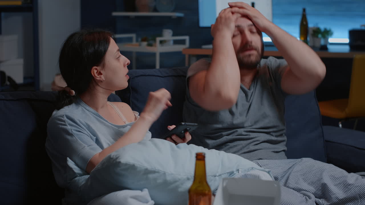 Angry husband and wife renters calculating household payments