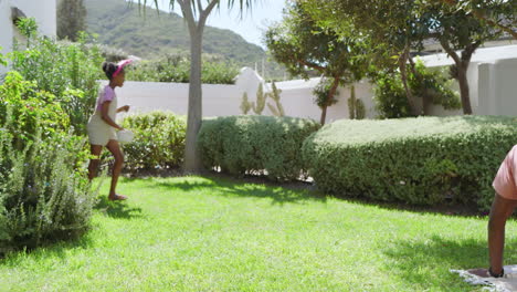 easter, girl playing in garden, holding watering can, enjoying sunny day