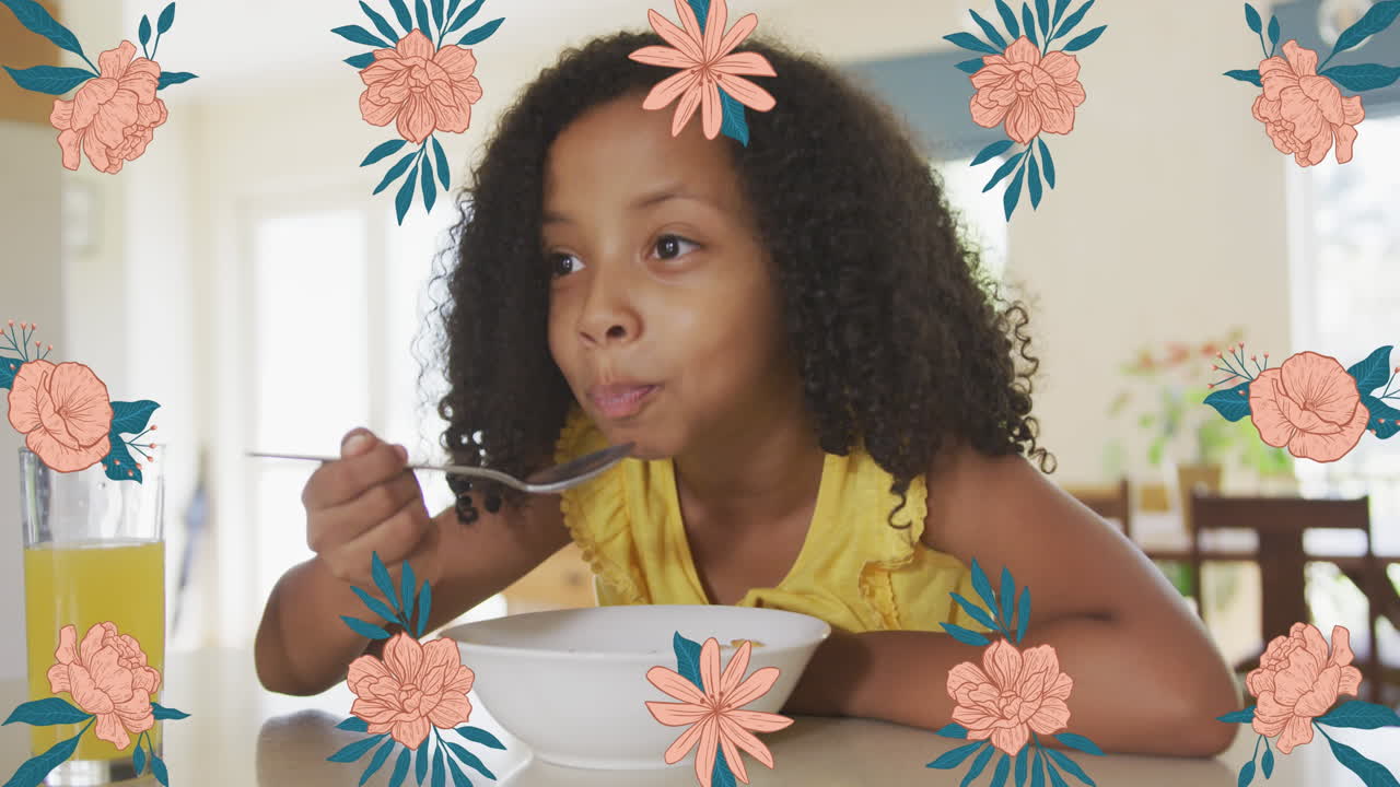 animación de flores sobre una chica afroamericana desayunando en casa