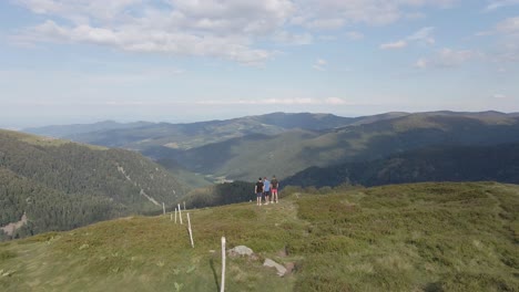 drone view of a group of friends on top of kastelberg mountain in france. vast valley views