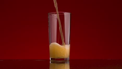 soda pouring into a glass