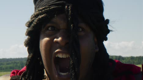 samson producing an earth shaking roar towards screen, biblical character with long dreads, israelite warrior and judge, black male in old testament, christian
