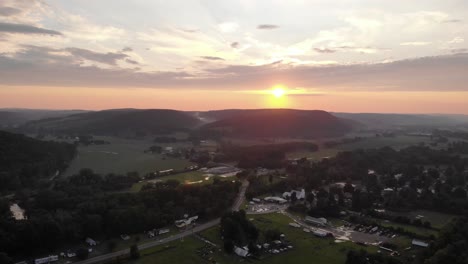 descending aerial view of the sunset in a town in maine, united states of america