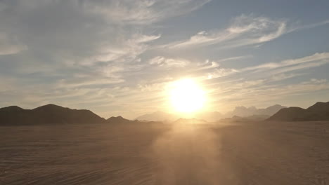 Off-roading-in-a-four-wheeler-in-Egypt's-Sinai-Desert---looking-at-the-dust-behind