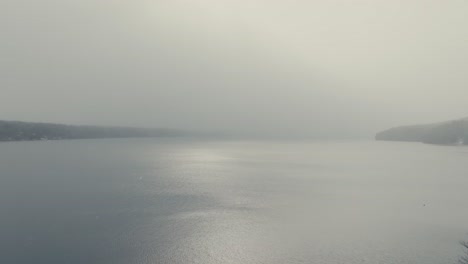 Overlooking-Lake-Massawippi-During-Winter-Snowfall-In-North-Hatley,-Quebec-Canada