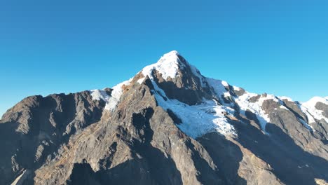 Flying-view-of-the-mountains,-snow-capped-La-Veronica,-Sacred-Valley,-Cusco