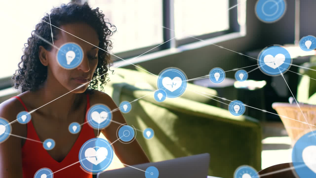 Animation of network of connections with icons over woman using laptop
