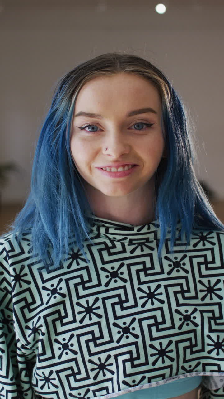 Vertical video of portrait of happy caucasian woman in dance studio