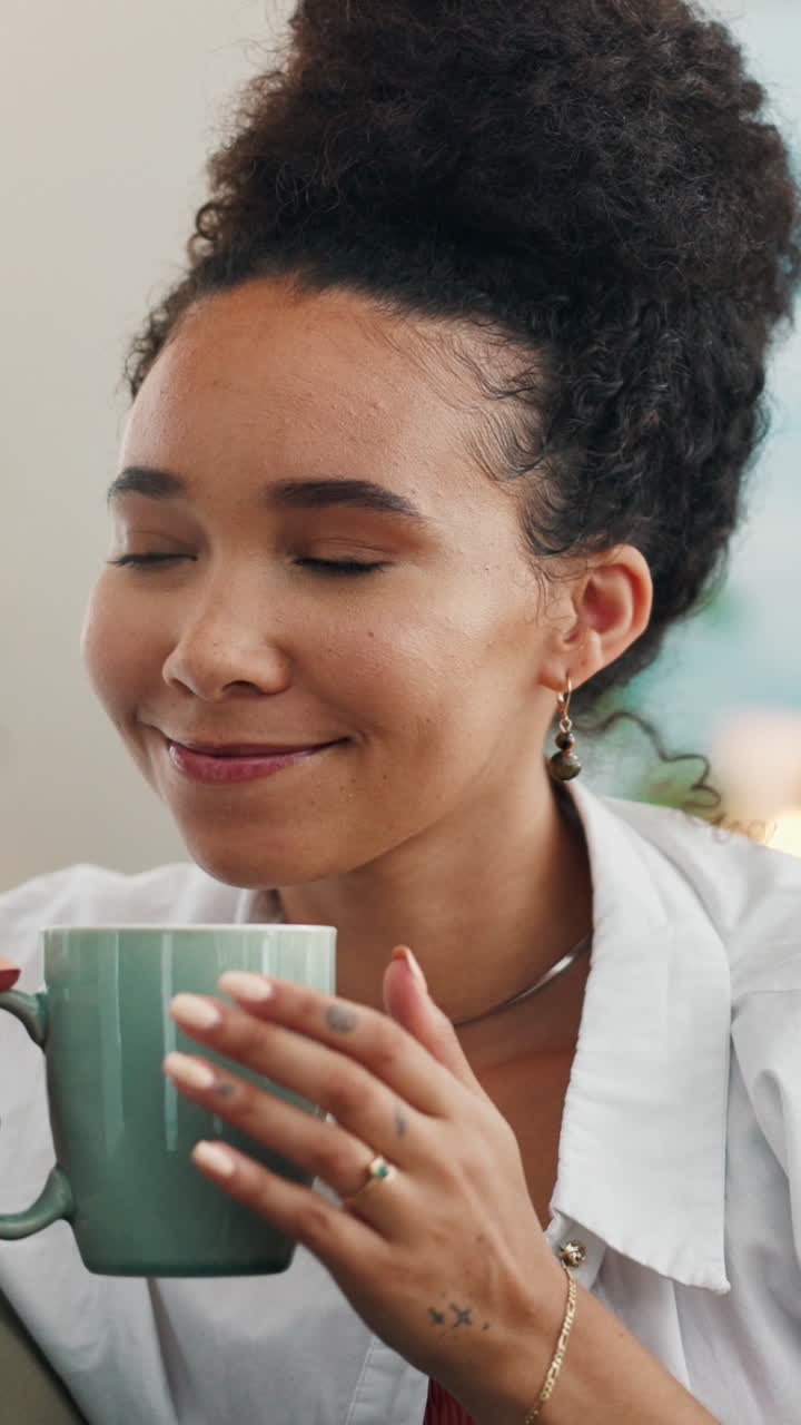 Young Woman Smelling and Enjoying a Warm Drink in a Mug
