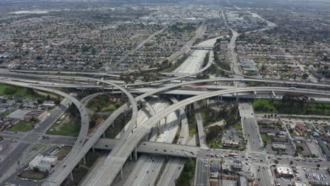 AERIAL:-Spectacular-Judge-Pregerson-Interchange-showing-multiple-Roads,-Bridges,-Highway-with-little-car-traffic-in-Los-Angeles,-California-on-Beautiful-Sunny-Day