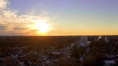 aerial drone overhead shot of the sunset in the small town of ovid, michigan.