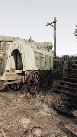 an old, covered wagon in the desert