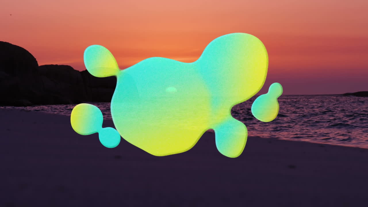 Animation of green and yellow blot moving over beach and sea at sunset