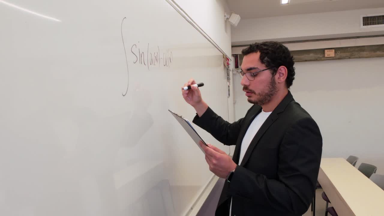 Educator Demonstrating a Concept on a Whiteboard
