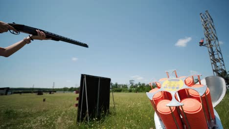 slow motion clay pigeon from the side. bench shooting on plates. v-log bench shooting on plates. automatic machine for throwing plates for shooting. throwing machine for bench shooting.