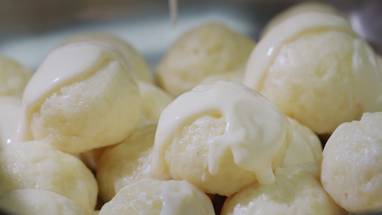 Dumplings are poured with delicious creamy sauce