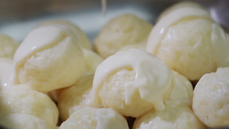 dumplings are poured with delicious creamy sauce