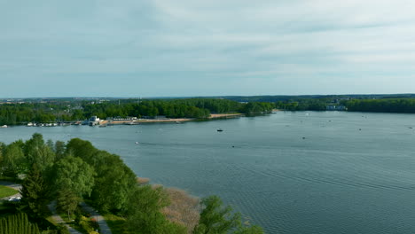 a panoramic view of ukiel lake in olsztyn, featuring calm waters and surrounding greenery