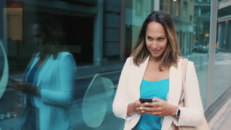 beautiful mixed race business woman walking through city