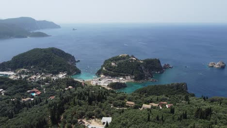 panoramic aerial view of corfu island bays, rocky shores, turquoise waters, and lush green vegetation in greece