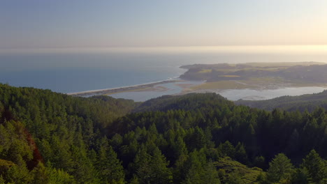 aerial view of sea bay below the mountains