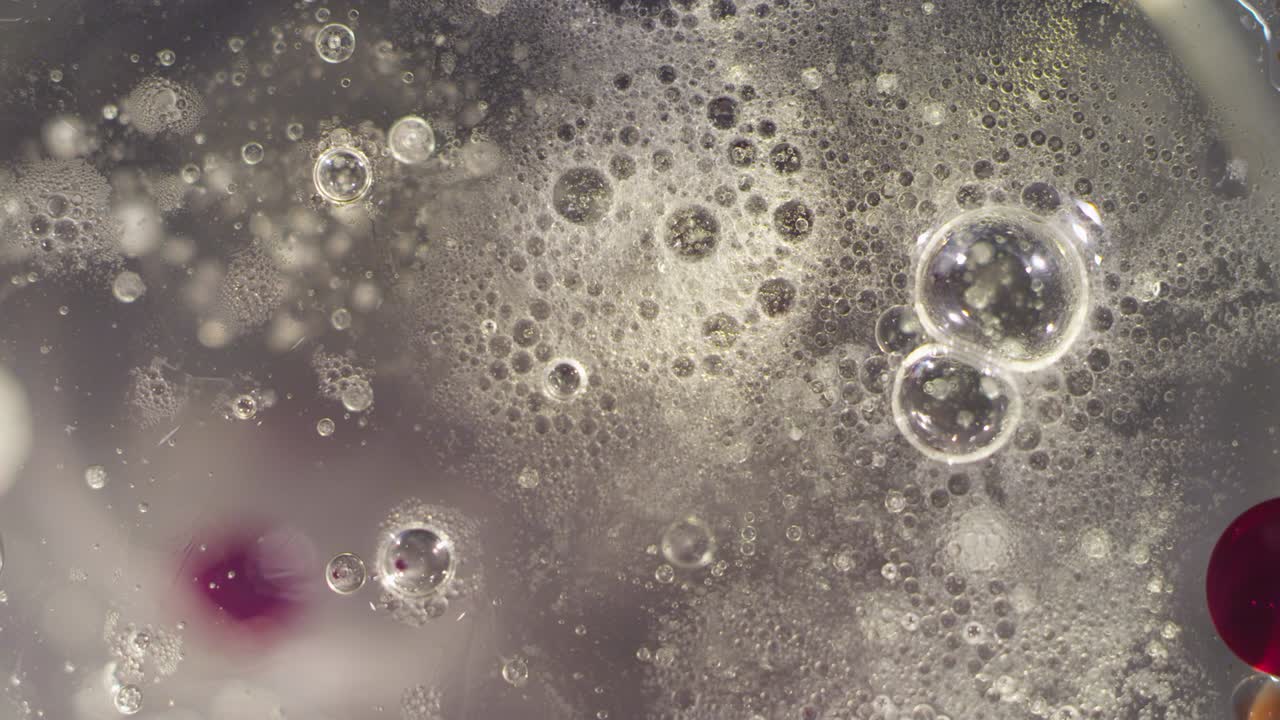 매크로 추상: 고 은 빛으로 부풀어오르는 액체 모션 텍스처 배경