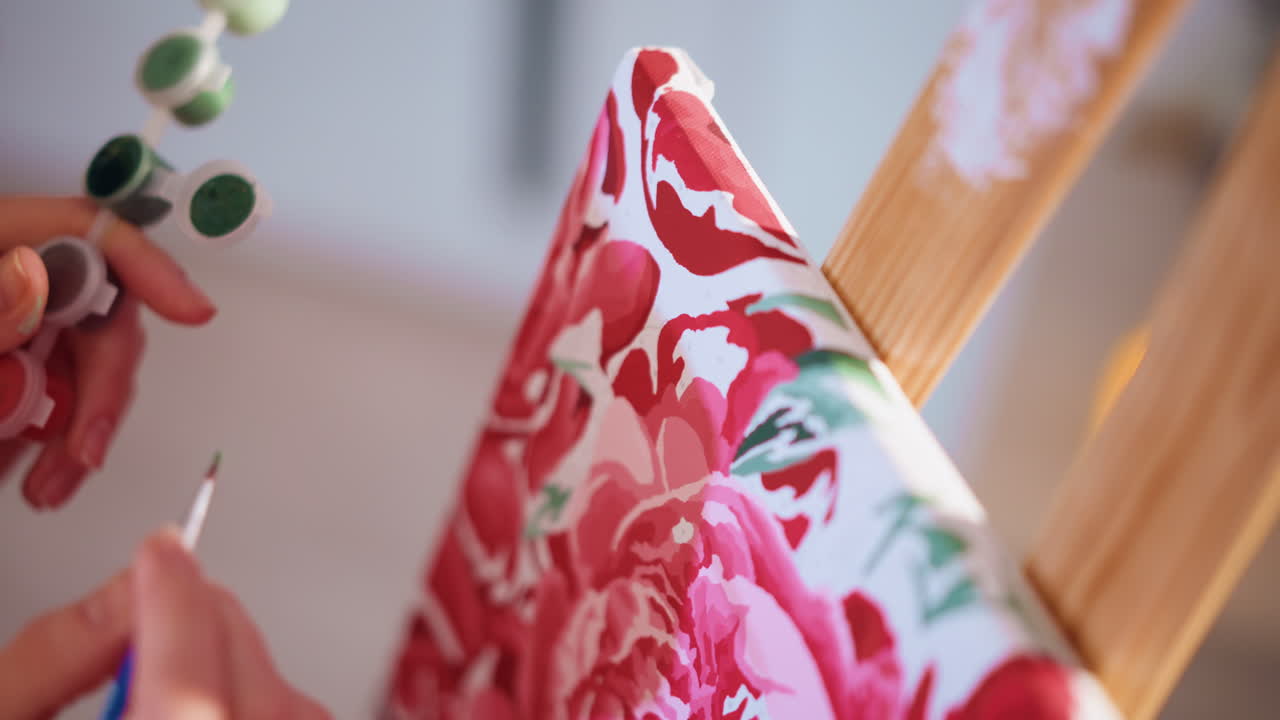 CloseUp Hands Painting Pink Canvas With Small Brush, Freelance Artist Adding Delicate Petals And Fine Outlining On Floral