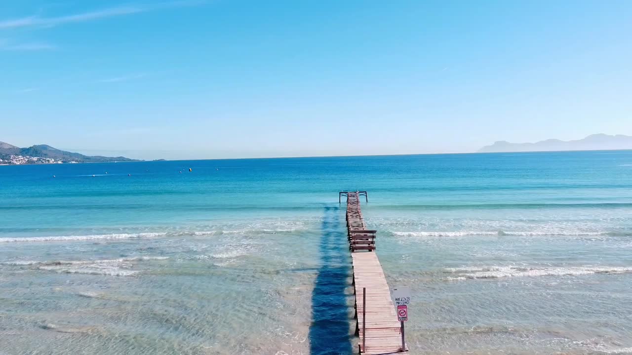 old pier on the playa de muro in mallorca