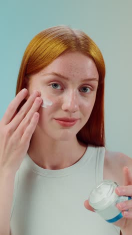 woman applying face cream