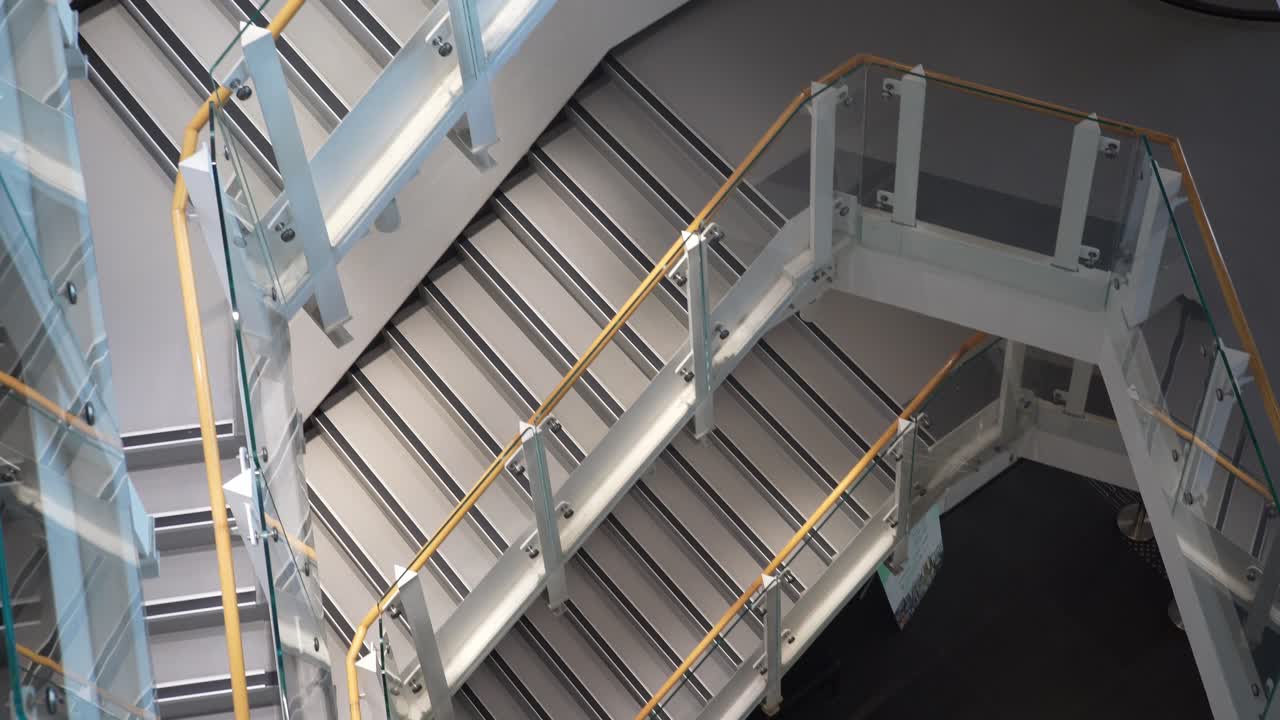 Looking Down At Empty Stairs In Hong Kong Art Centre With Slow Tilt Up View