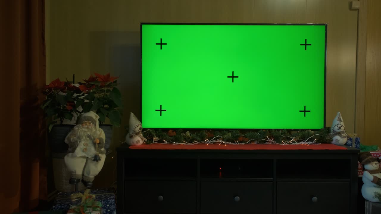 거실에서 녹색 스크린을 가진 방의 인테리어.