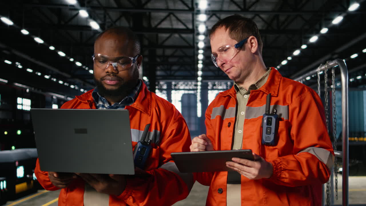 Diverse workers using devices to manage steel production tasks