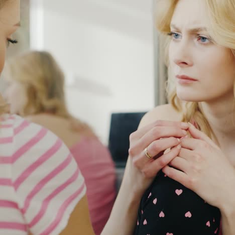 young woman comforts and supports his girlfriend who is upset and crying 1